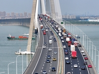 Vehicles travel on the Shanghai-Suzhou-Nantong Yangtze River Bridge in Suzhou, China, on September 14, 2024. (