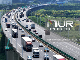 Vehicles travel on the Shanghai-Suzhou-Nantong Yangtze River Bridge in Suzhou, China, on September 14, 2024. (