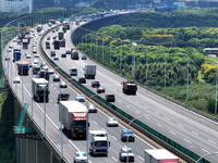 Vehicles travel on the Shanghai-Suzhou-Nantong Yangtze River Bridge in Suzhou, China, on September 14, 2024. (