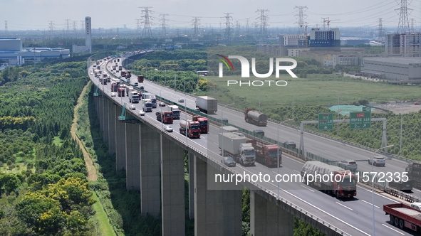 Vehicles travel on the Shanghai-Suzhou-Nantong Yangtze River Bridge in Suzhou, China, on September 14, 2024. 