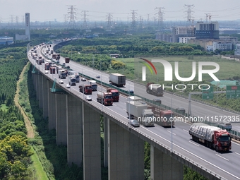 Vehicles travel on the Shanghai-Suzhou-Nantong Yangtze River Bridge in Suzhou, China, on September 14, 2024. (