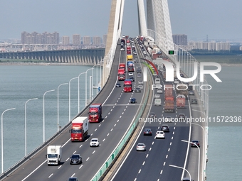 Vehicles travel on the Shanghai-Suzhou-Nantong Yangtze River Bridge in Suzhou, China, on September 14, 2024. (