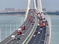 Vehicles travel on the Shanghai-Suzhou-Nantong Yangtze River Bridge in Suzhou, China, on September 14, 2024. (