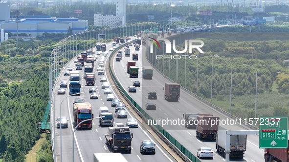 Vehicles travel on the Shanghai-Suzhou-Nantong Yangtze River Bridge in Suzhou, China, on September 14, 2024. 