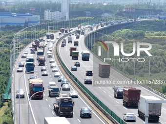 Vehicles travel on the Shanghai-Suzhou-Nantong Yangtze River Bridge in Suzhou, China, on September 14, 2024. (