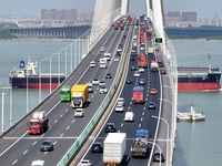 Vehicles travel on the Shanghai-Suzhou-Nantong Yangtze River Bridge in Suzhou, China, on September 14, 2024. (