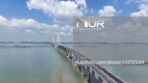 Vehicles travel on the Shanghai-Suzhou-Nantong Yangtze River Bridge in Suzhou, China, on September 14, 2024. 