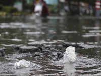 People travel in the rain in Huai'an, China, on September 14, 2024. (