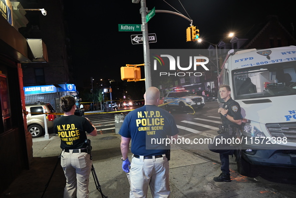 NYPD crime scene unit investigators are at the scene. A 24-year-old man is shot and killed in Bronx, New York, United States, on September 1...