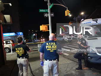 NYPD crime scene unit investigators are at the scene. A 24-year-old man is shot and killed in Bronx, New York, United States, on September 1...