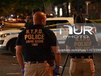 NYPD crime scene unit investigators are at the scene. A 24-year-old man is shot and killed in Bronx, New York, United States, on September 1...