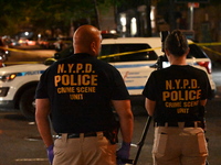 NYPD crime scene unit investigators are at the scene. A 24-year-old man is shot and killed in Bronx, New York, United States, on September 1...