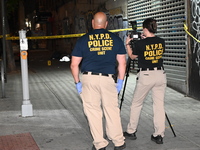 NYPD crime scene unit investigators are at the scene. A 24-year-old man is shot and killed in Bronx, New York, United States, on September 1...