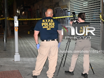 NYPD crime scene unit investigators are at the scene. A 24-year-old man is shot and killed in Bronx, New York, United States, on September 1...