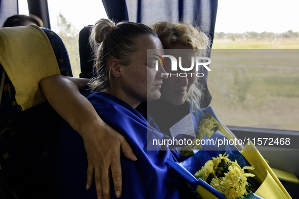 Ukrainian prisoners of war (POWs) react as they return to Ukraine from captivity after a swap with Russia in Chernihiv Region, Ukraine, on S...