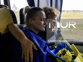 Ukrainian prisoners of war (POWs) react as they return to Ukraine from captivity after a swap with Russia in Chernihiv Region, Ukraine, on S...