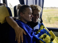 Ukrainian prisoners of war (POWs) react as they return to Ukraine from captivity after a swap with Russia in Chernihiv Region, Ukraine, on S...