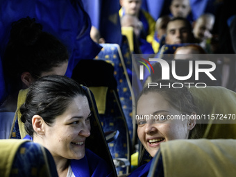 Ukrainian prisoners of war (POWs) react as they return to Ukraine from captivity after a swap with Russia in Chernihiv Region, Ukraine, on S...