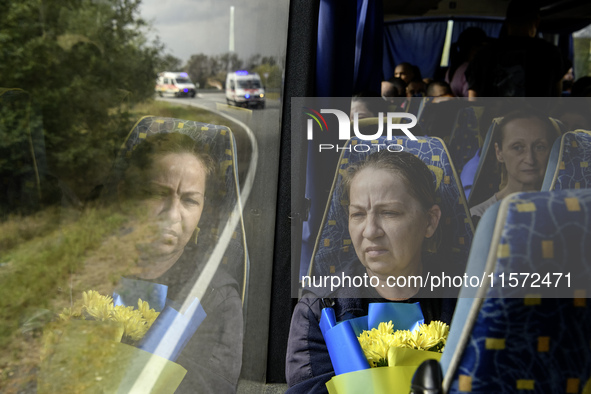 Ukrainian prisoners of war (POWs) react as they return to Ukraine from captivity after a swap with Russia in Chernihiv Region, Ukraine, on S...