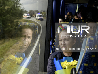 Ukrainian prisoners of war (POWs) react as they return to Ukraine from captivity after a swap with Russia in Chernihiv Region, Ukraine, on S...