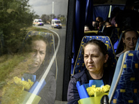 Ukrainian prisoners of war (POWs) react as they return to Ukraine from captivity after a swap with Russia in Chernihiv Region, Ukraine, on S...