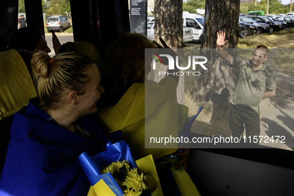 Ukrainian prisoners of war (POWs) react as they return to Ukraine from captivity after a swap with Russia in Chernihiv Region, Ukraine, on S...