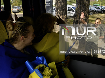 Ukrainian prisoners of war (POWs) react as they return to Ukraine from captivity after a swap with Russia in Chernihiv Region, Ukraine, on S...