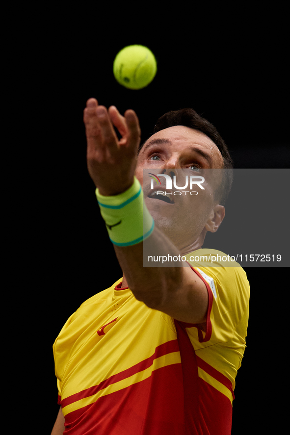 Roberto Bautista Agut of Spain serves during the game against Arthur Fils of France during the 2024 Davis Cup Group B Stage match between Fr...