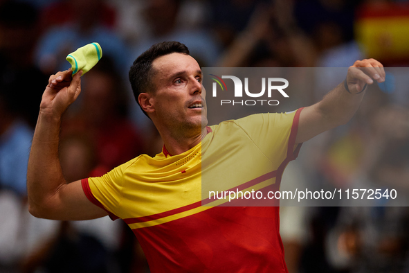 Roberto Bautista Agut of Spain throws his wristband to the crowd following the game against Arthur Fils of France during the 2024 Davis Cup...