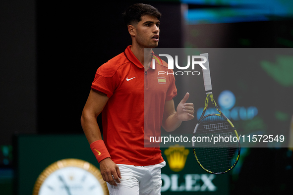 Carlos Alcaraz of Spain plays with the racket during the game against Ugo Humbert of France during the 2024 Davis Cup Group B Stage match be...