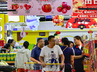 Consumers shop at a supermarket in Qingzhou, China, on September 9, 2024. On September 14, 2024, the National Bureau of Statistics releases...