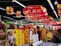 Consumers shop at a supermarket in Qingzhou, China, on September 9, 2024. On September 14, 2024, the National Bureau of Statistics releases...