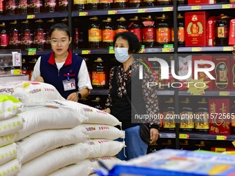 Consumers shop at a supermarket in Qingzhou, China, on September 9, 2024. On September 14, 2024, the National Bureau of Statistics releases...