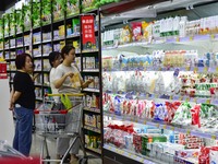 Consumers shop at a supermarket in Qingzhou, China, on September 9, 2024. On September 14, 2024, the National Bureau of Statistics releases...