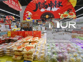 Consumers shop at a supermarket in Qingzhou, China, on September 9, 2024. On September 14, 2024, the National Bureau of Statistics releases...