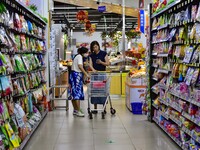 Consumers shop at a supermarket in Qingzhou, China, on September 9, 2024. On September 14, 2024, the National Bureau of Statistics releases...