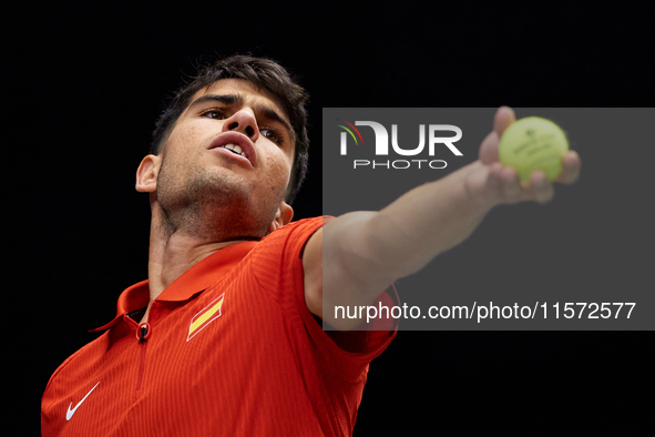 Carlos Alcaraz of Spain serves during the game against Ugo Humbert of France during the 2024 Davis Cup Group B Stage match between France an...