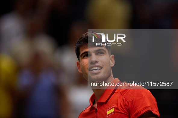 Carlos Alcaraz of Spain smiles following the game against Ugo Humbert of France during the 2024 Davis Cup Group B Stage match between France...