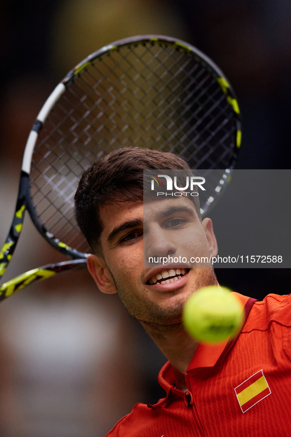 Carlos Alcaraz of Spain throws a ball to the crowd following the game against Ugo Humbert of France during the 2024 Davis Cup Group B Stage...