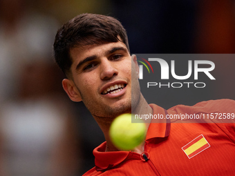 Carlos Alcaraz of Spain looks at the ball following the game against Ugo Humbert of France during the 2024 Davis Cup Group B Stage match bet...