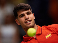 Carlos Alcaraz of Spain looks at the ball following the game against Ugo Humbert of France during the 2024 Davis Cup Group B Stage match bet...