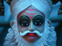 An idol of the Hindu Lord Vishwakarma is portrayed at a workshop before being sold to a customer in different parts of Kathmandu Valley for...