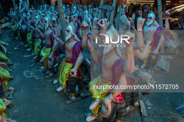 Artists prepare an idol of Nepali God Vishwakarma, the lord of metallurgy and god of architecture, at a workshop in Lalitpur, Nepal, on Sept...