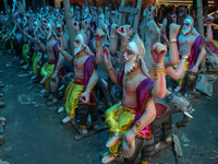 Artists prepare an idol of Nepali God Vishwakarma, the lord of metallurgy and god of architecture, at a workshop in Lalitpur, Nepal, on Sept...