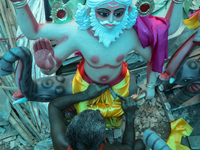 Artists prepare an idol of Nepali God Vishwakarma, the lord of metallurgy and god of architecture, at a workshop in Lalitpur, Nepal, on Sept...