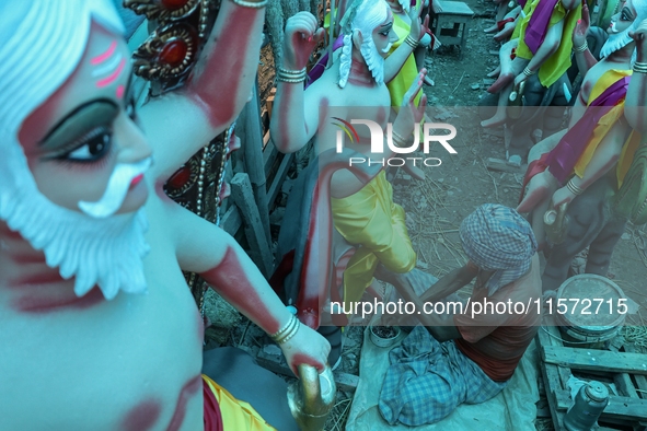 Artists prepare an idol of Nepali God Vishwakarma, the lord of metallurgy and god of architecture, at a workshop in Lalitpur, Nepal, on Sept...