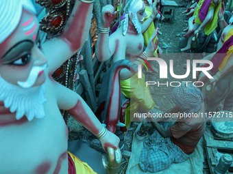 Artists prepare an idol of Nepali God Vishwakarma, the lord of metallurgy and god of architecture, at a workshop in Lalitpur, Nepal, on Sept...