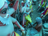 Artists prepare an idol of Nepali God Vishwakarma, the lord of metallurgy and god of architecture, at a workshop in Lalitpur, Nepal, on Sept...