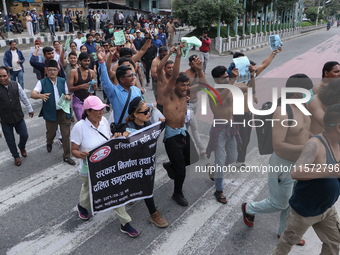 Nepali Dalit rights activists hold a demonstration in Kathmandu, Nepal, on September 14, 2024, demanding the implementation of constitutiona...