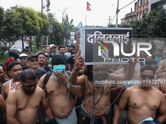 Nepali Dalit rights activists hold a demonstration in Kathmandu, Nepal, on September 14, 2024, demanding the implementation of constitutiona...